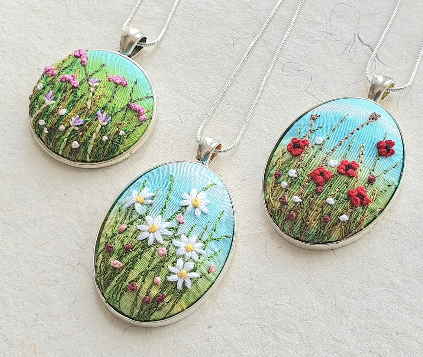 Hand-embroidered floral pendants