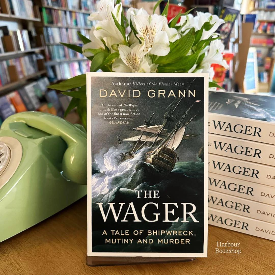 David Grann’s The Wager displayed with flowers inside Harbour Bookshop