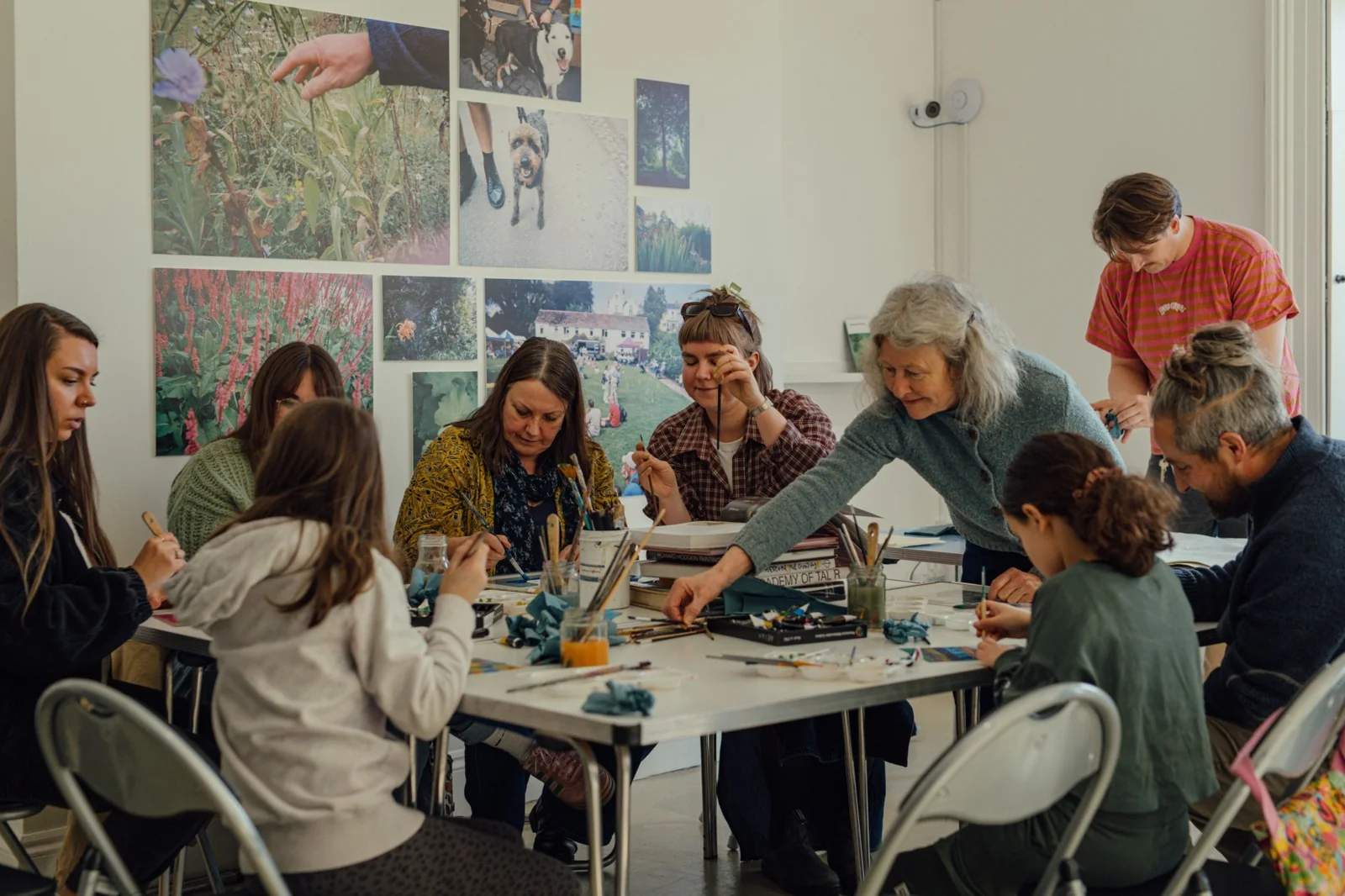 Participants making art around a table at Harbour House
