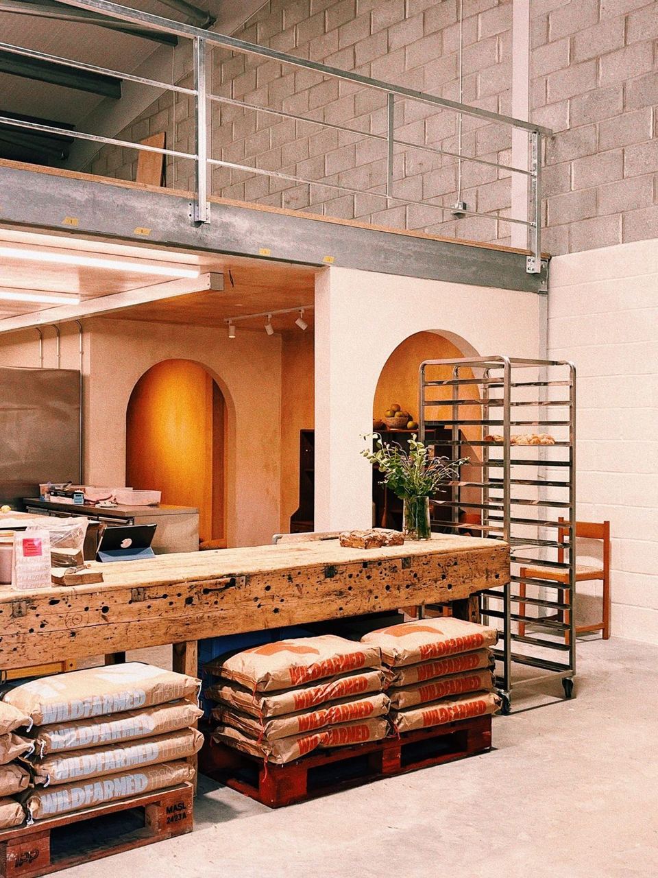 Peach arches and bakery equipment inside Heartbreak Bakery