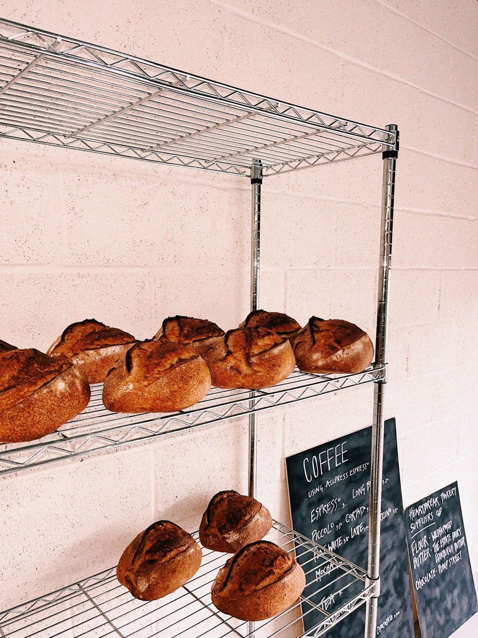 Golden loaves on bakery racks