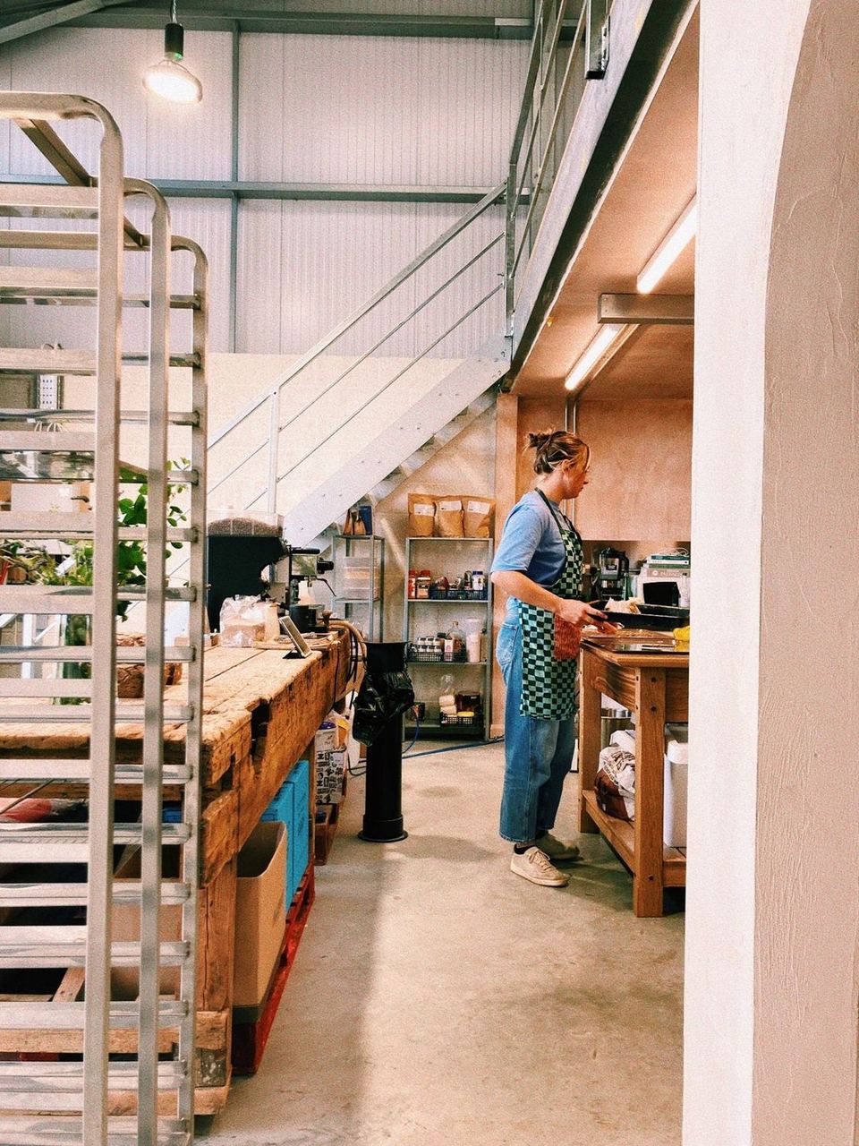 Customers at the counter beneath the bakery’s high roof