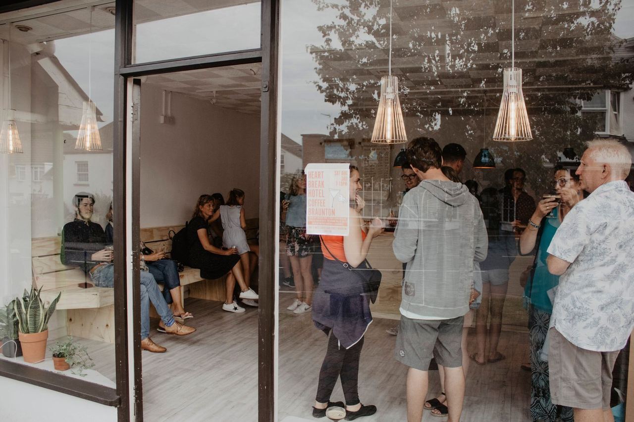 Customers at the entrance to Heartbreak Hotel Coffee
