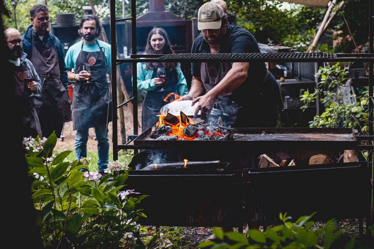 Guests learning to cook over open fire at High Grange