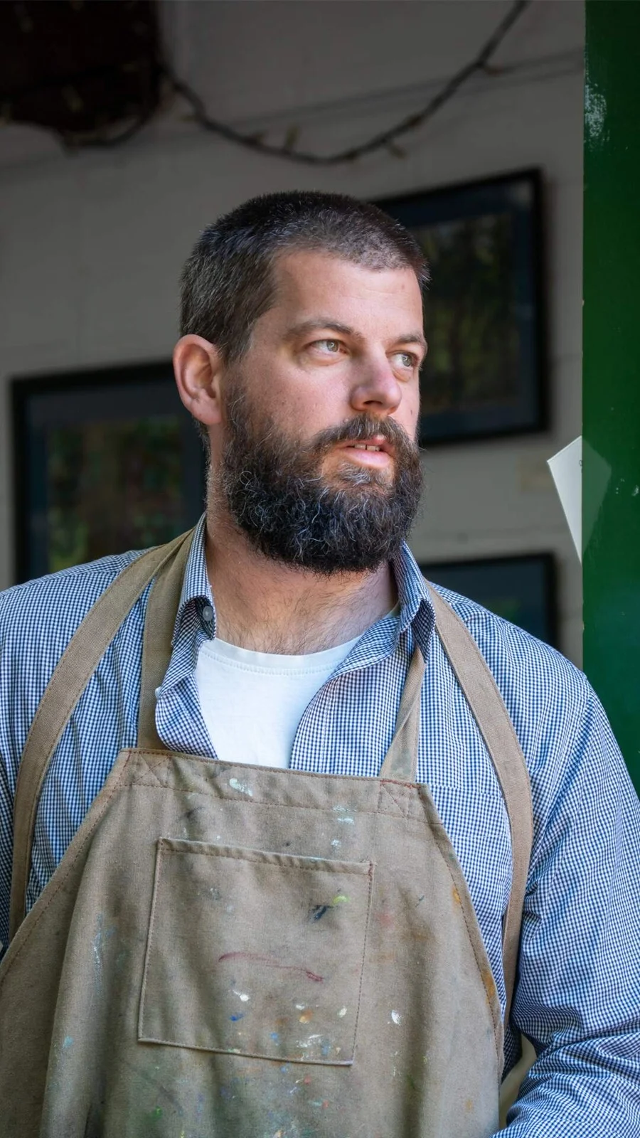Portrait of James Murch wearing a studio apron