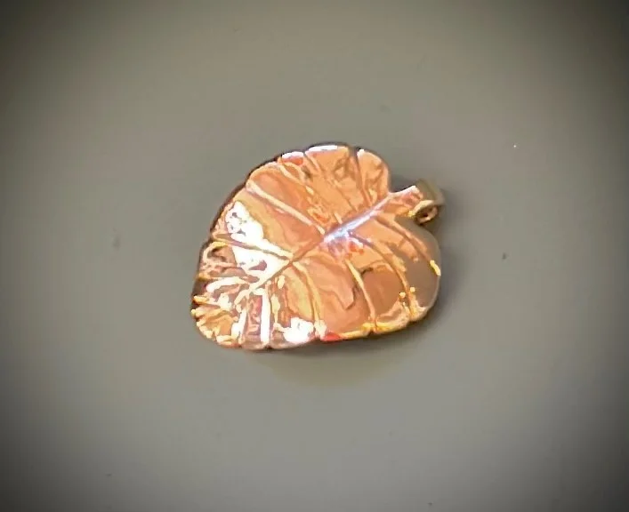 A leaf-shaped handmade jewellery piece by Jo Bradford