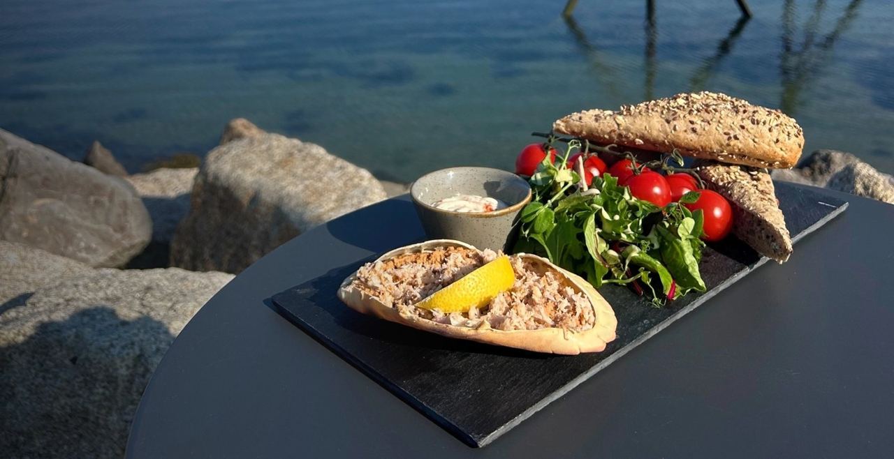 A plate of food beside the estuary