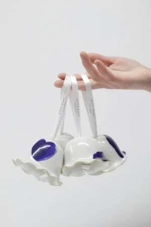 Handmade fluted ceramic bells by Kitty Ward