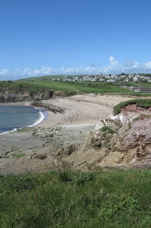 View across Leas Foot Sands towards Thurlestone village and green fields