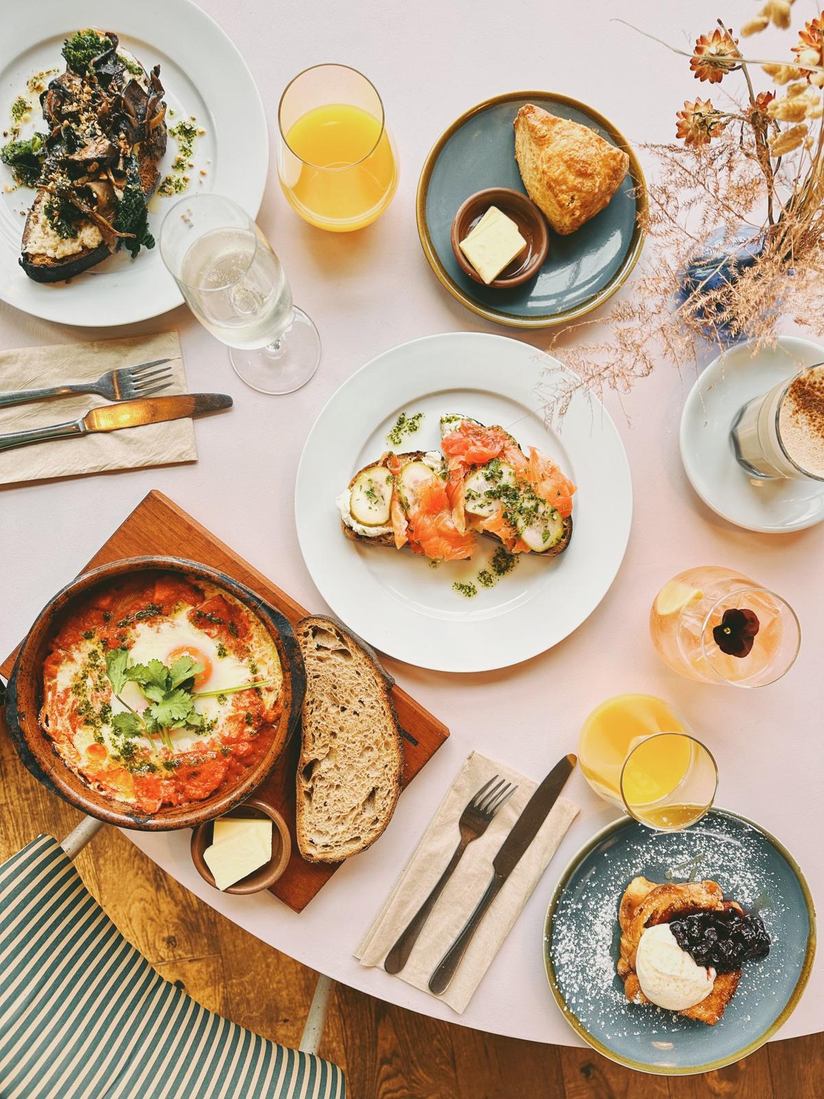 An overhead spread of colourful brunch dishes at The Lost Kitchen
