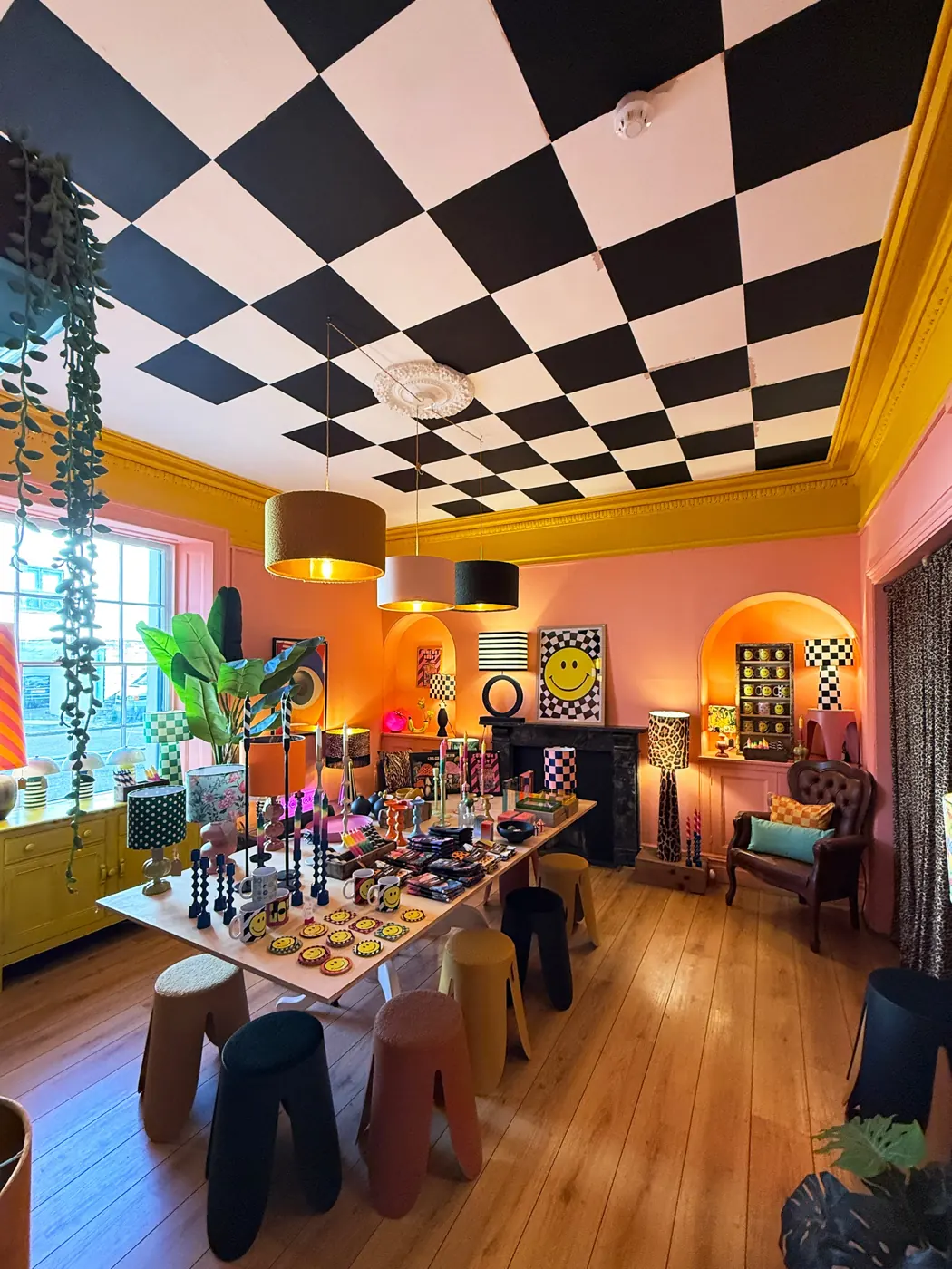 Orange room at Love Frankie with a chequered ceiling and homeware displays