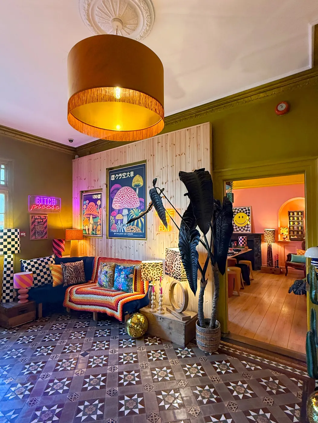 Love Frankie hallway with patterned floor tiles and bold lampshades