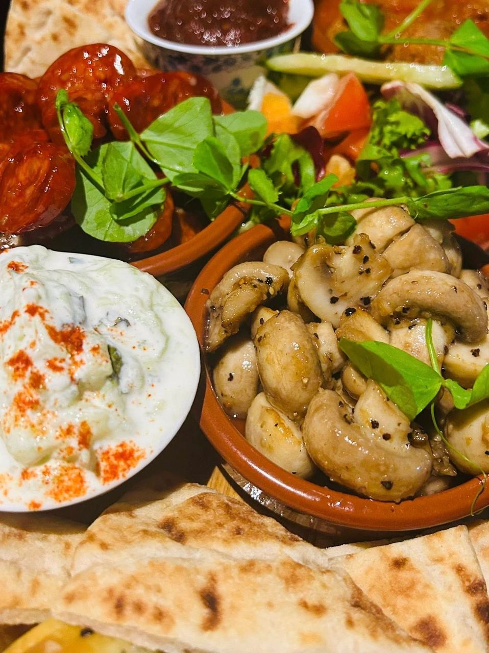 Mediterranean-style food spread at The Mad Merchant