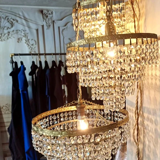 Chandeliers and clothing rails inside Maison et Vie