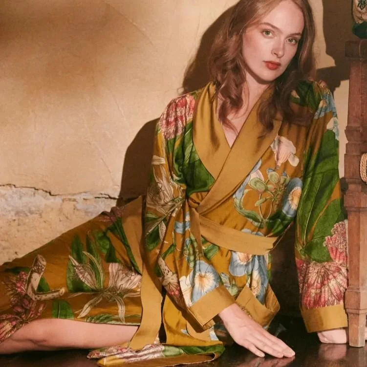 A model wearing a colourful printed One Hundred Stars gown