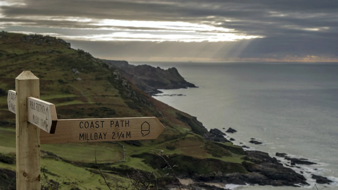 Wooden coast-path sign above the sea between Mill Bay and Prawle Point