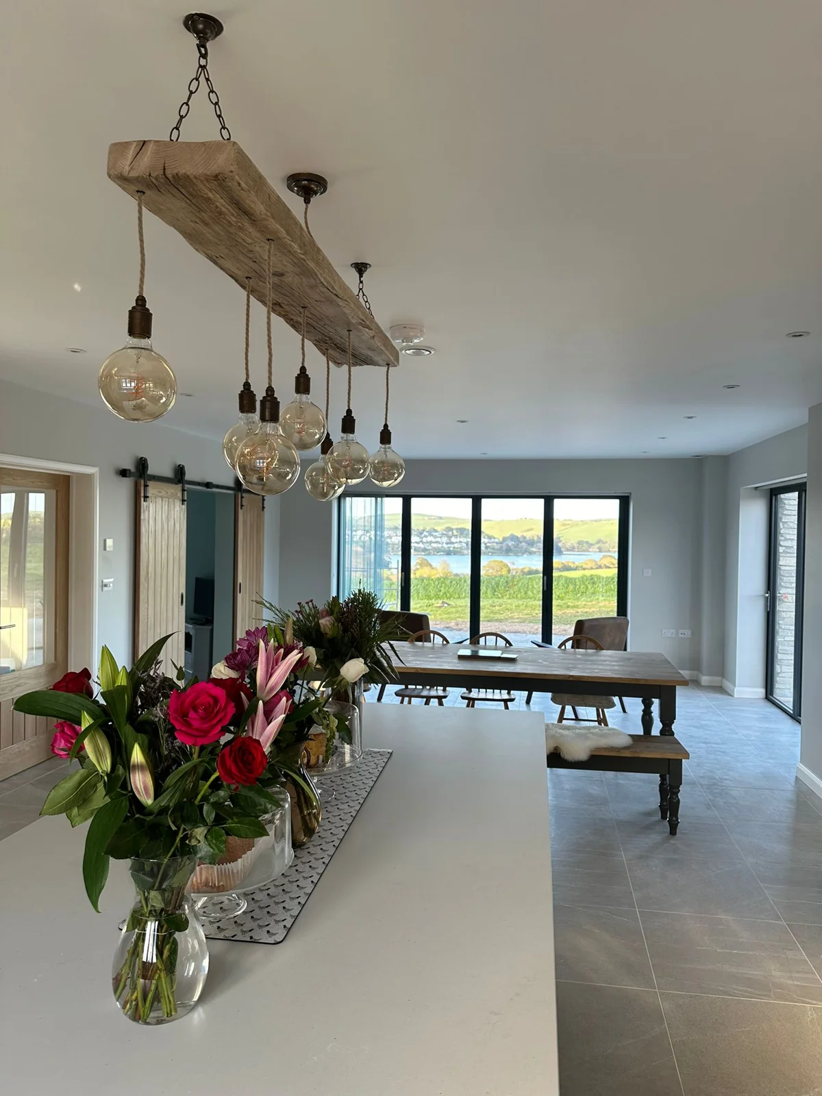 A pale timber MooBoo beam light in a bright kitchen