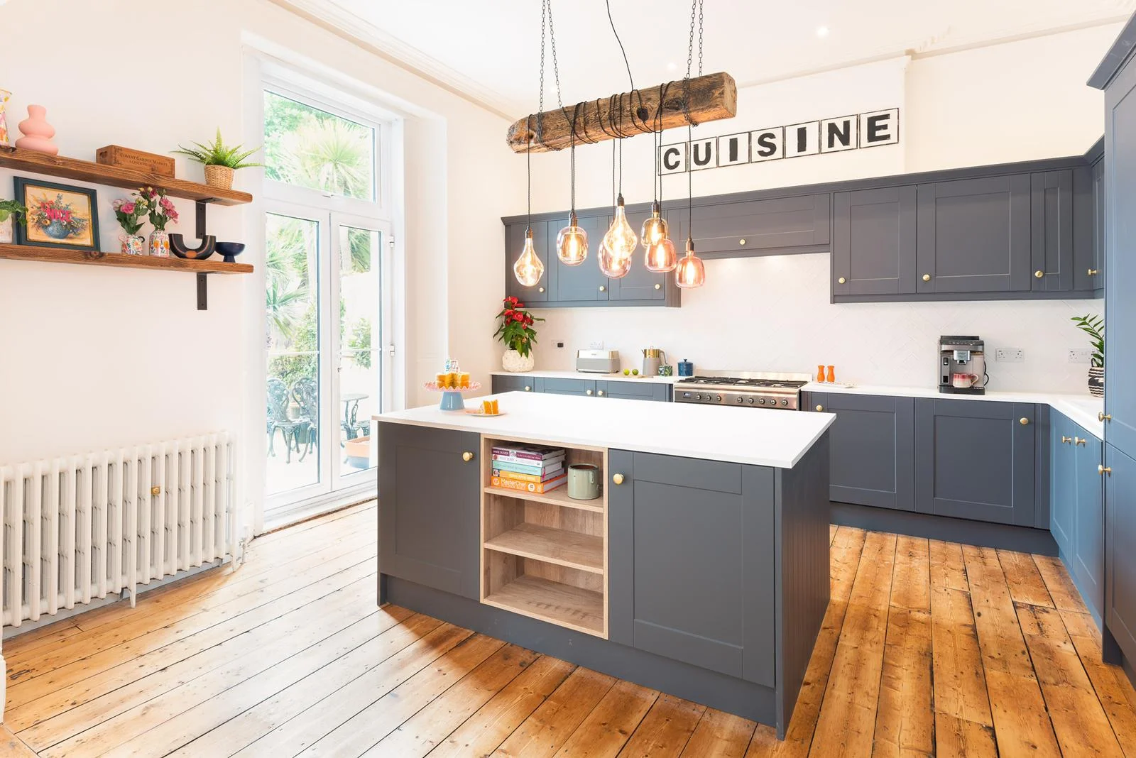 A rustic MooBoo light over a kitchen island