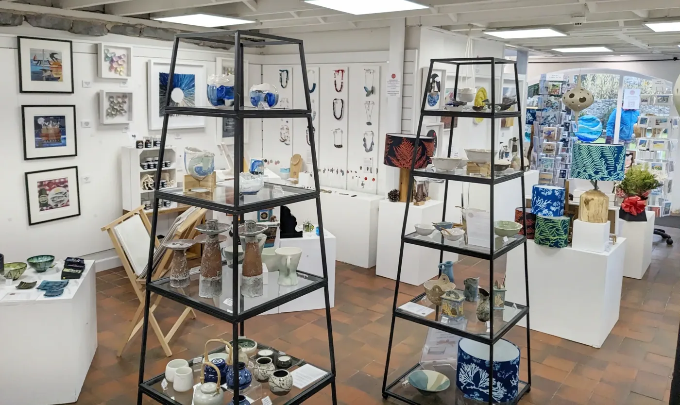 Glass, ceramics and framed art displayed inside Mooch Art & Makers