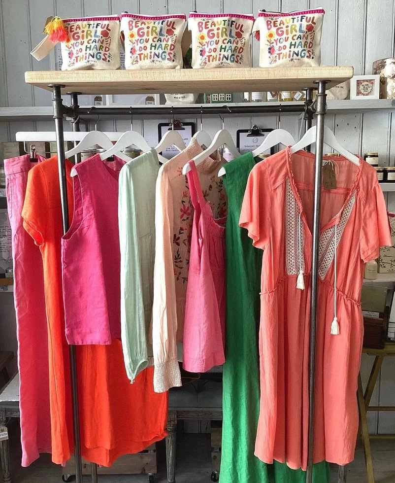 Rail of colourful patterned preloved clothing