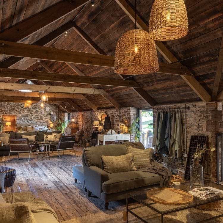 Seating and soft furnishings beneath the timber roof of Nkuku’s mezzanine