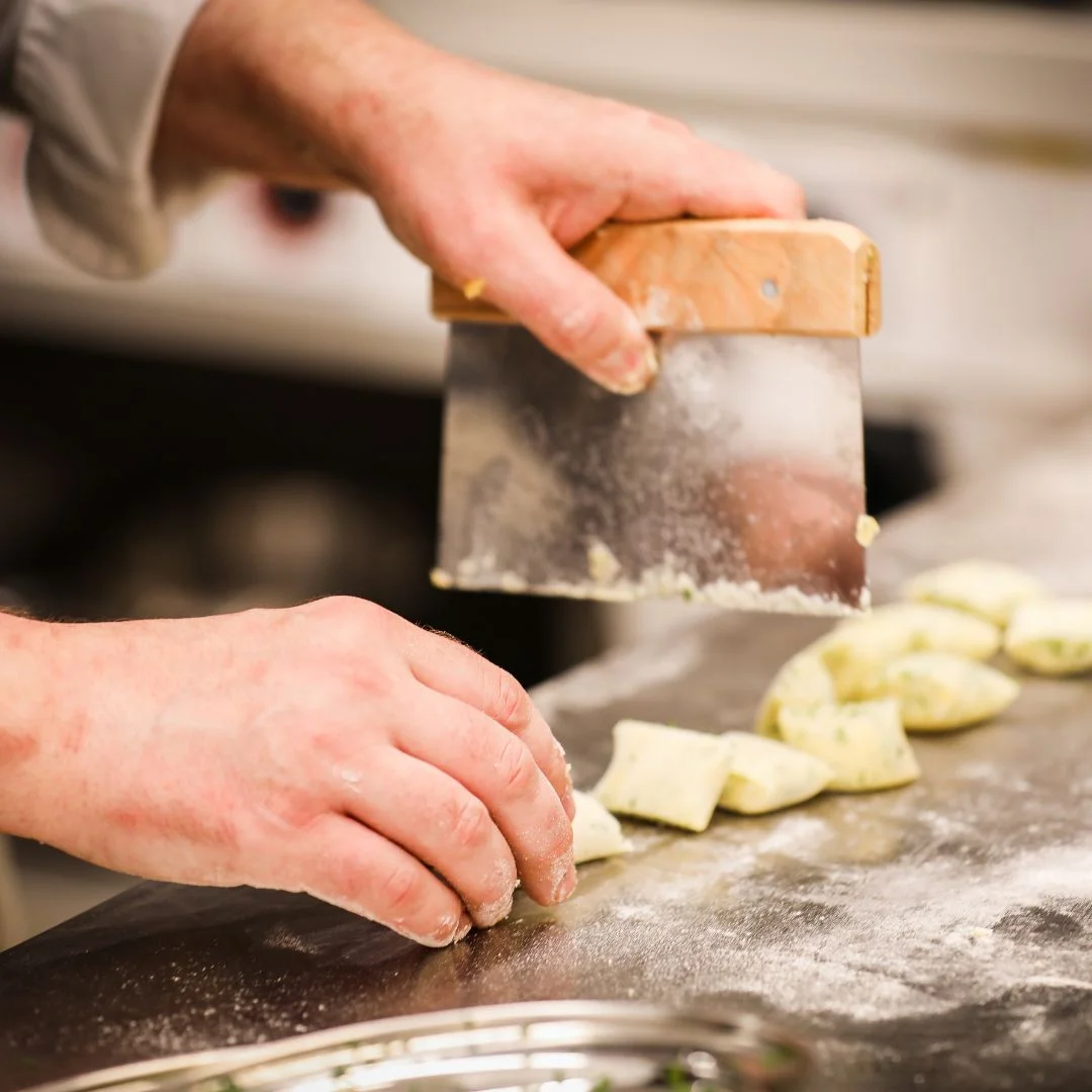 Chef preparing ingredients at Nomad Larder
