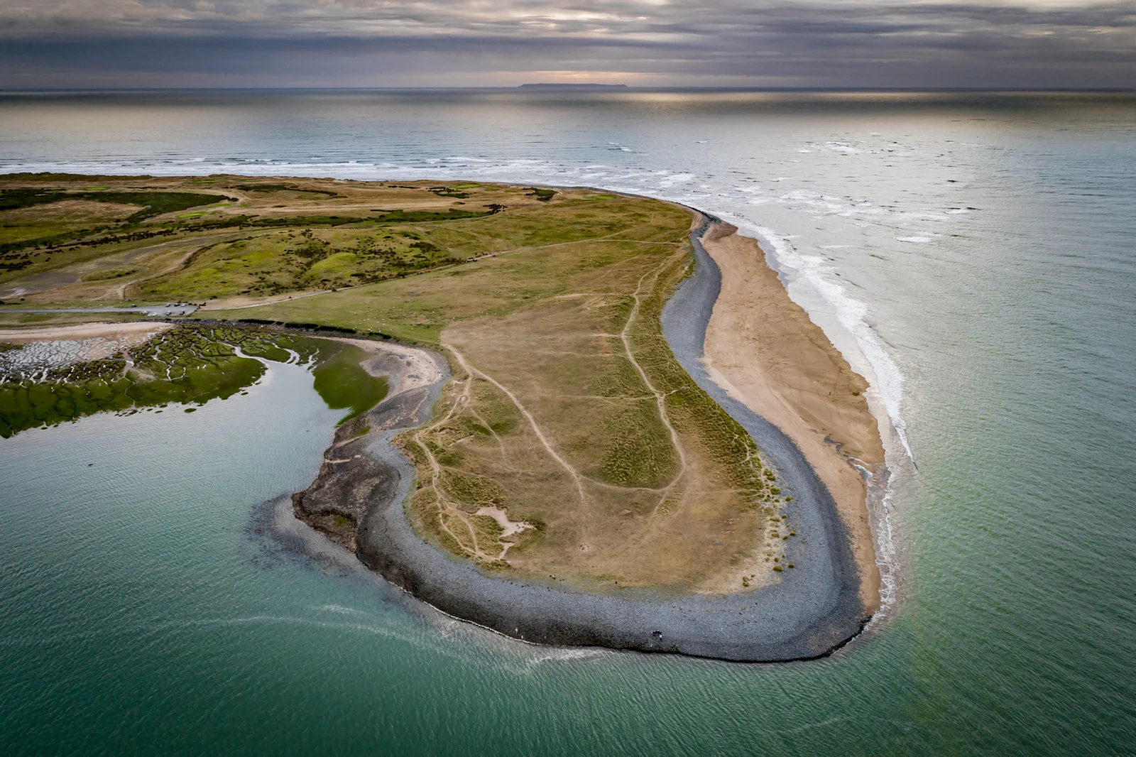 Aerial view over Northam Burrows, the pebble ridge and the coast