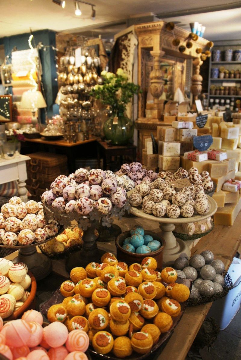 Handmade soaps and bath products arranged on tiered stands inside Odds & Suds Ashburton