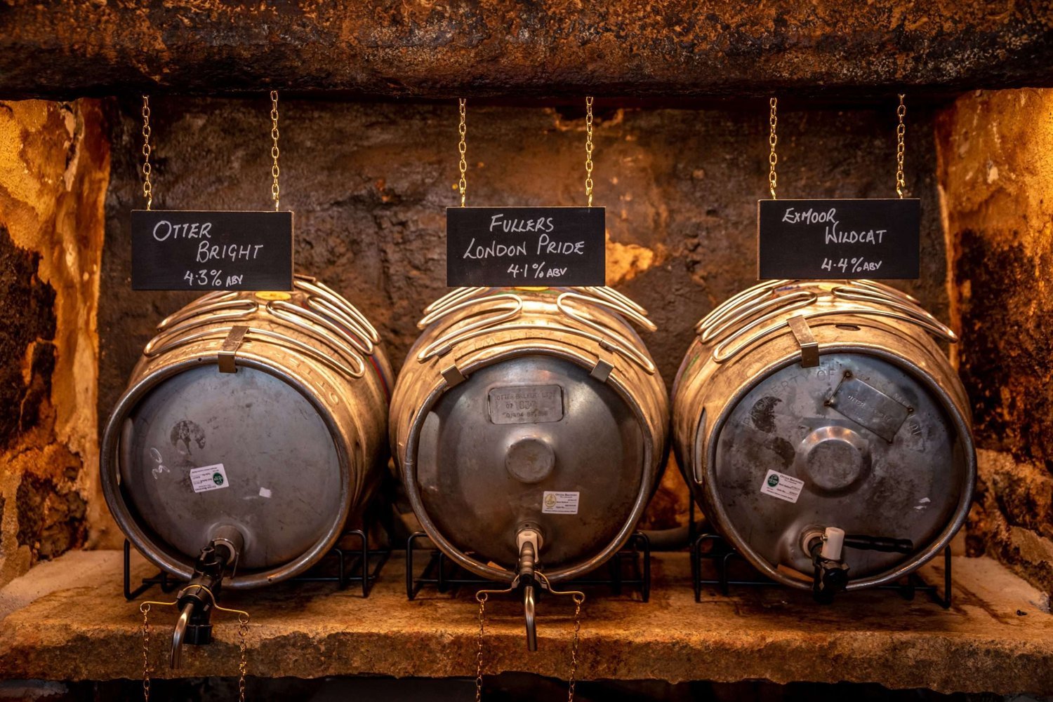 Ale casks lined up behind the bar at the Old Exeter Inn