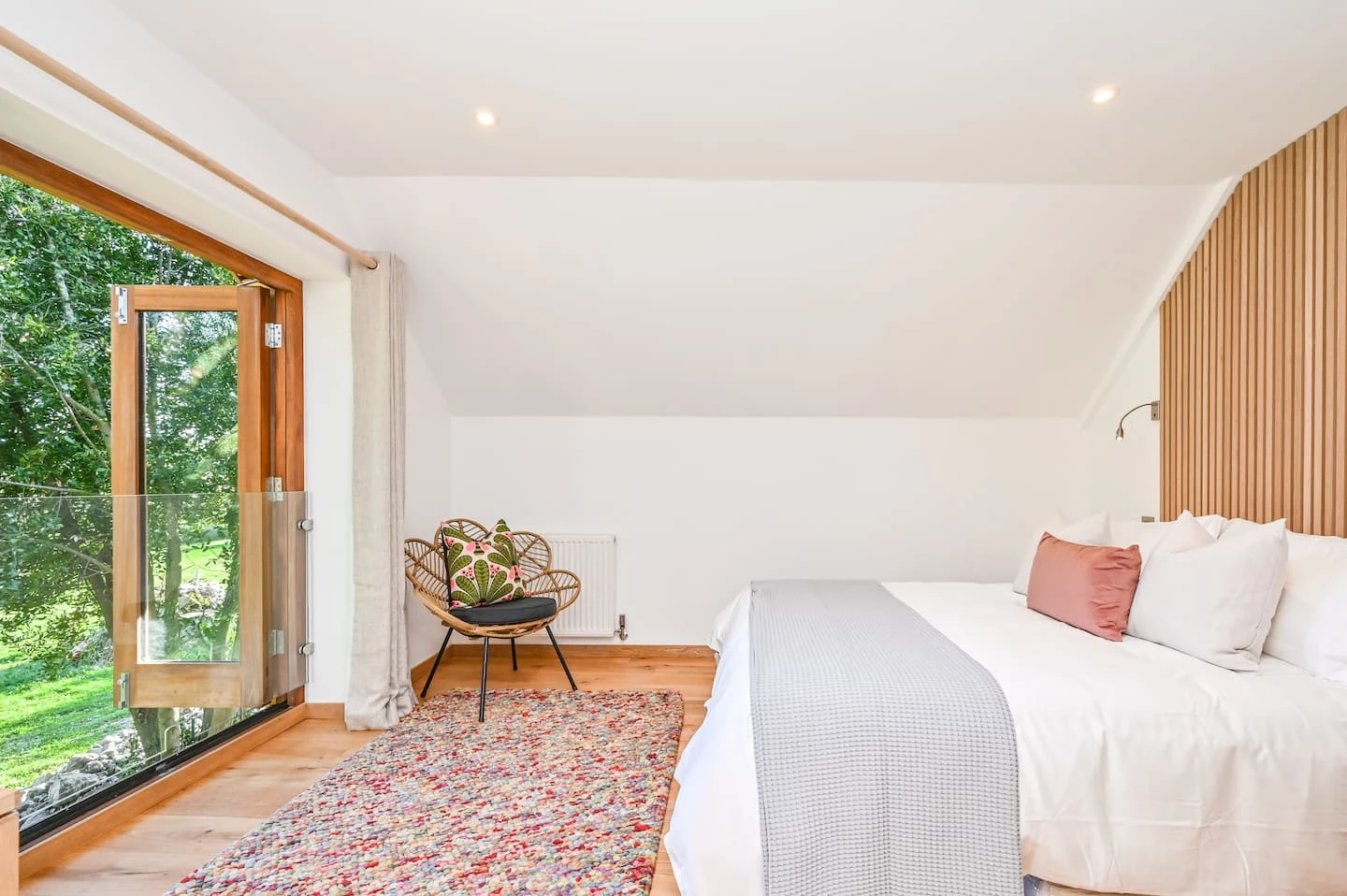Bedroom opening towards the green meadow