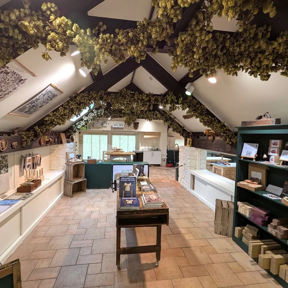Timber beams and craft displays inside Orchard Carving Studio