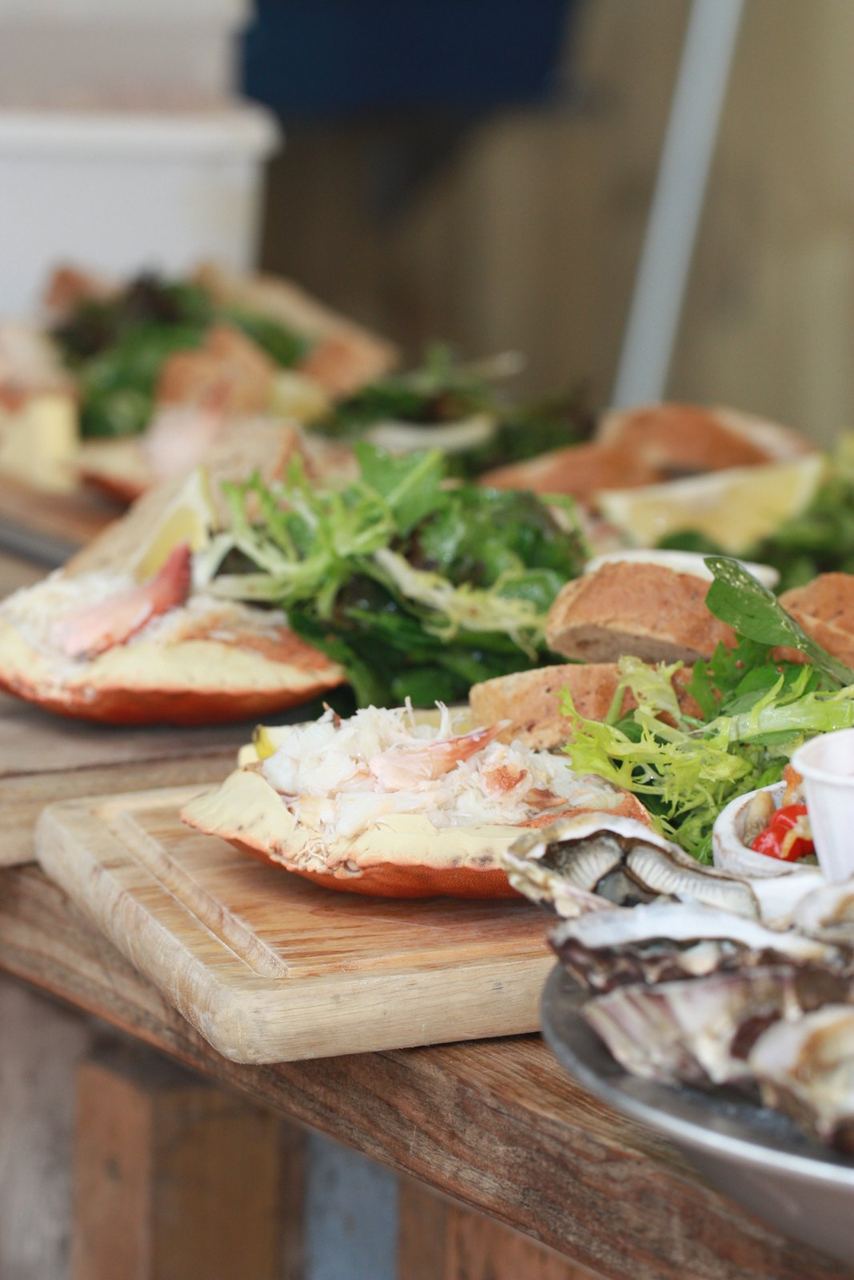 Shellfish and salad being served at The Oyster Shack