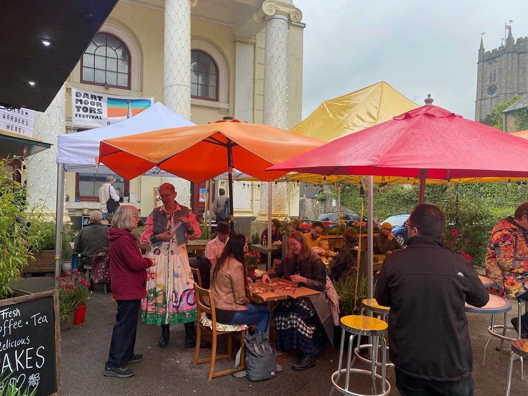 Pink, orange and yellow umbrellas over the courtyard tables at Pizza Amore in Ashburton