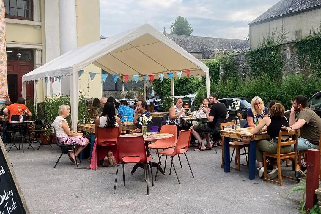 Colourful chairs and outdoor tables in Pizza Amore’s courtyard