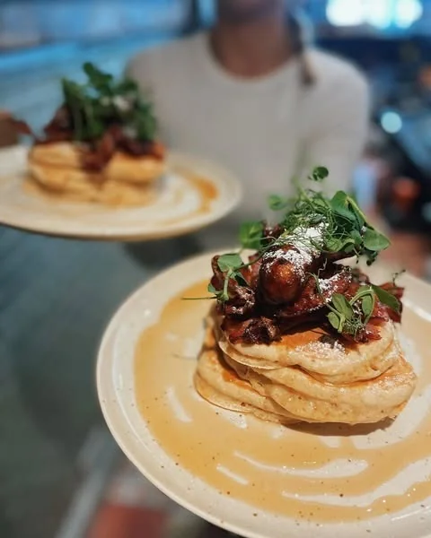 Pancakes with a savoury topping and greens