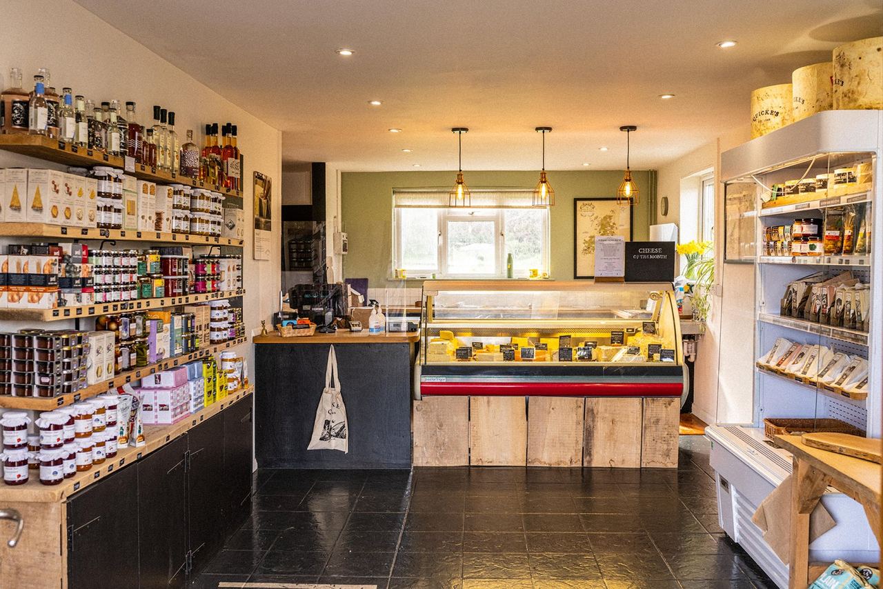 Shelves and cheese counter inside Quicke’s farm shop