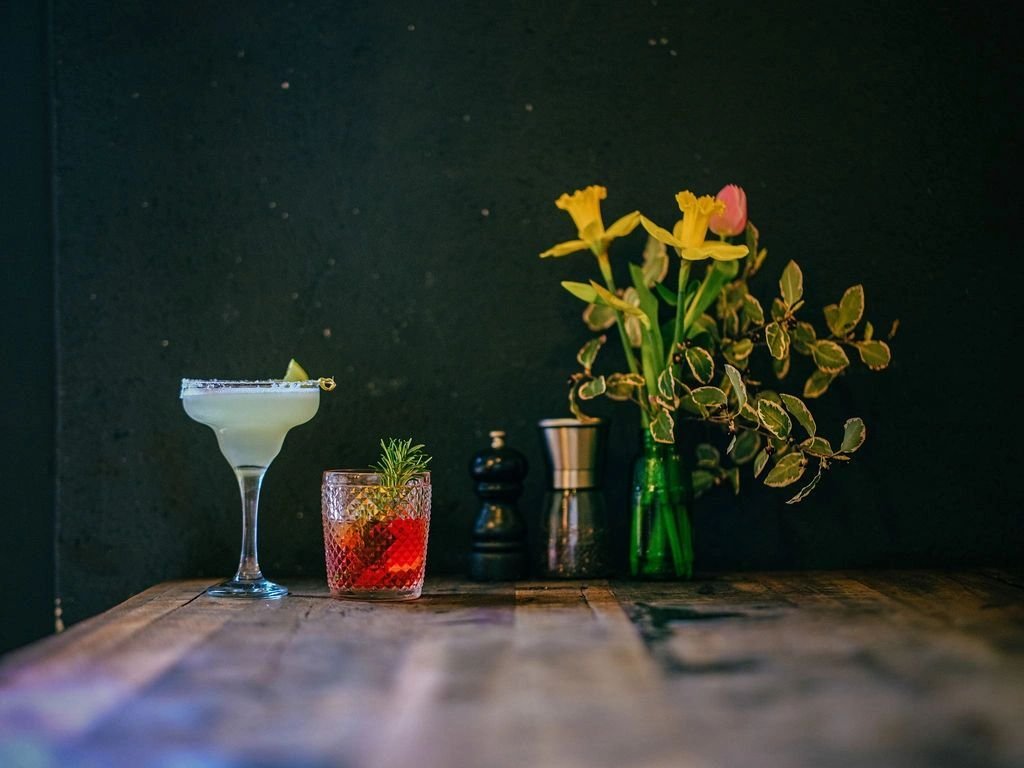 Cocktails and flowers on a table at Rafikis