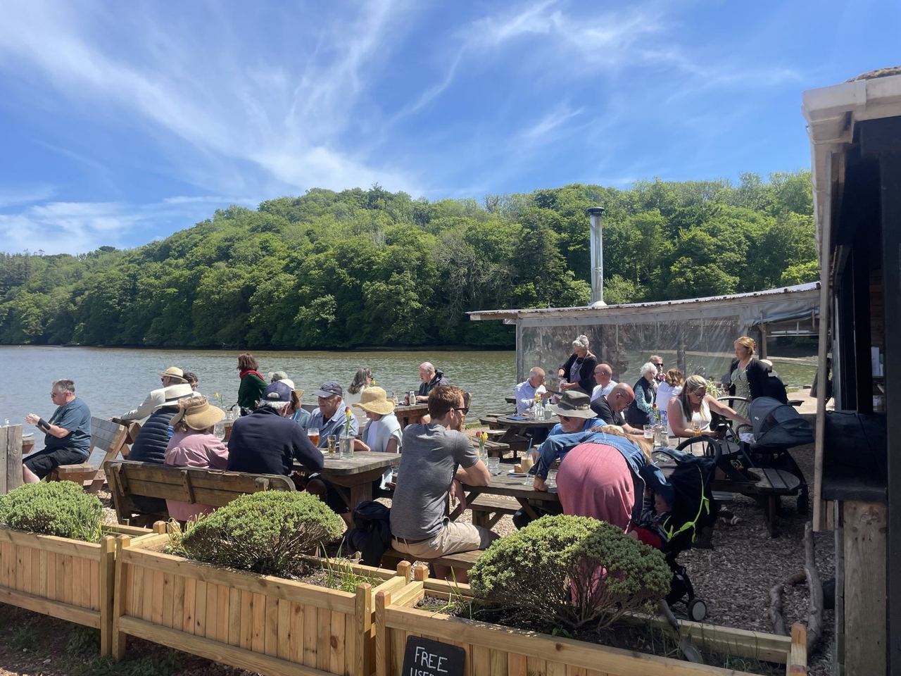Guests enjoying the waterside terrace at The River Shack