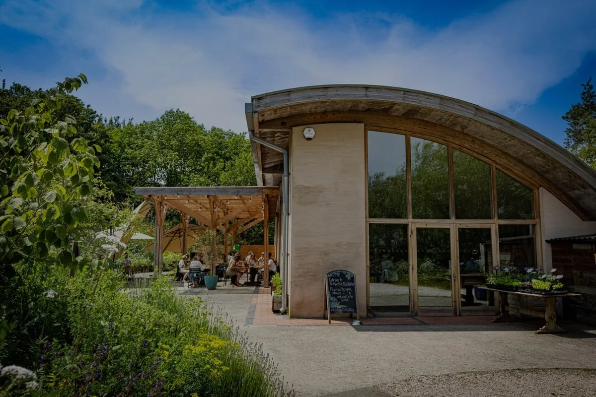 The curved restaurant building and garden at Riverford Field Kitchen