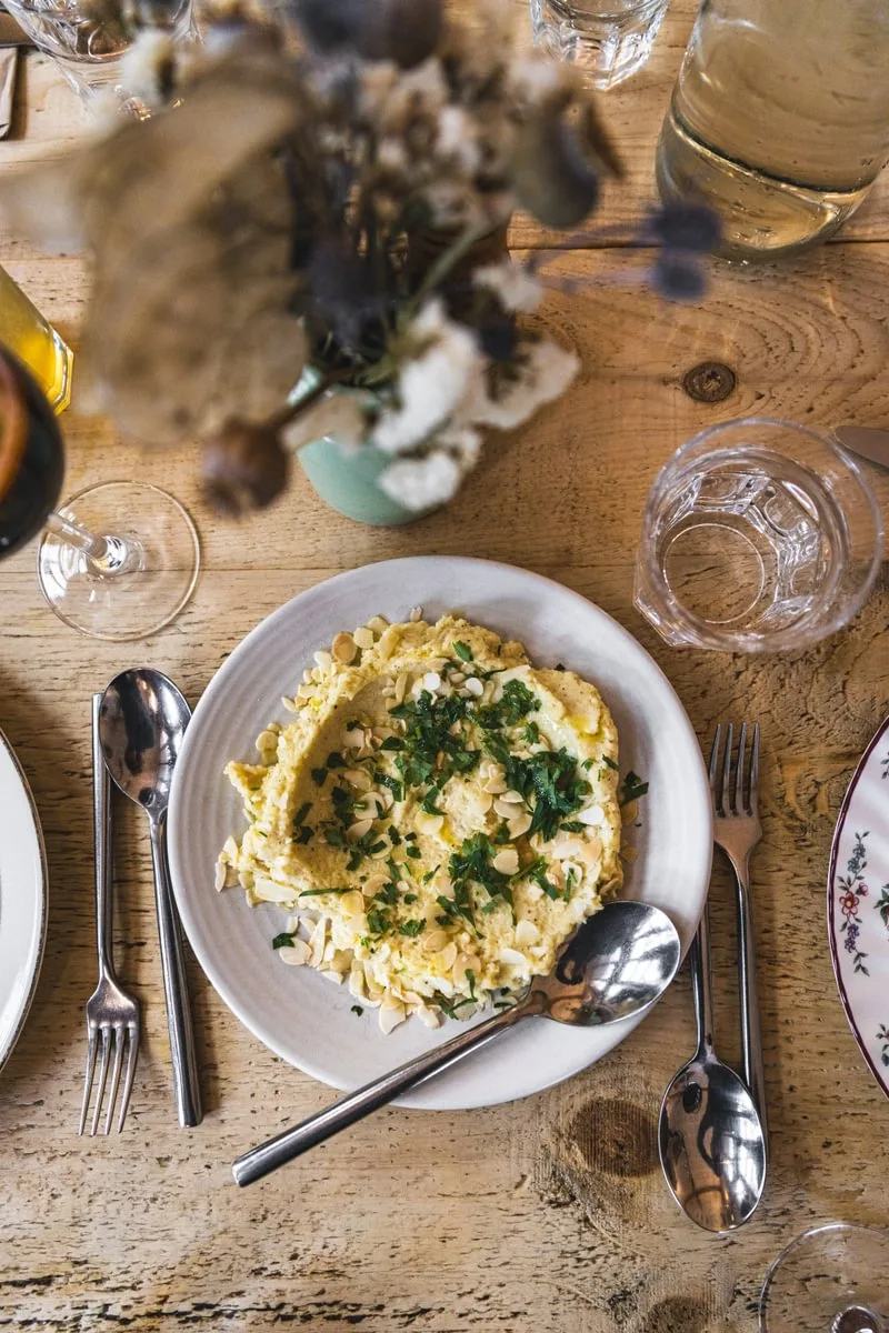 A seasonal plate on a wooden table at Riverford Field Kitchen