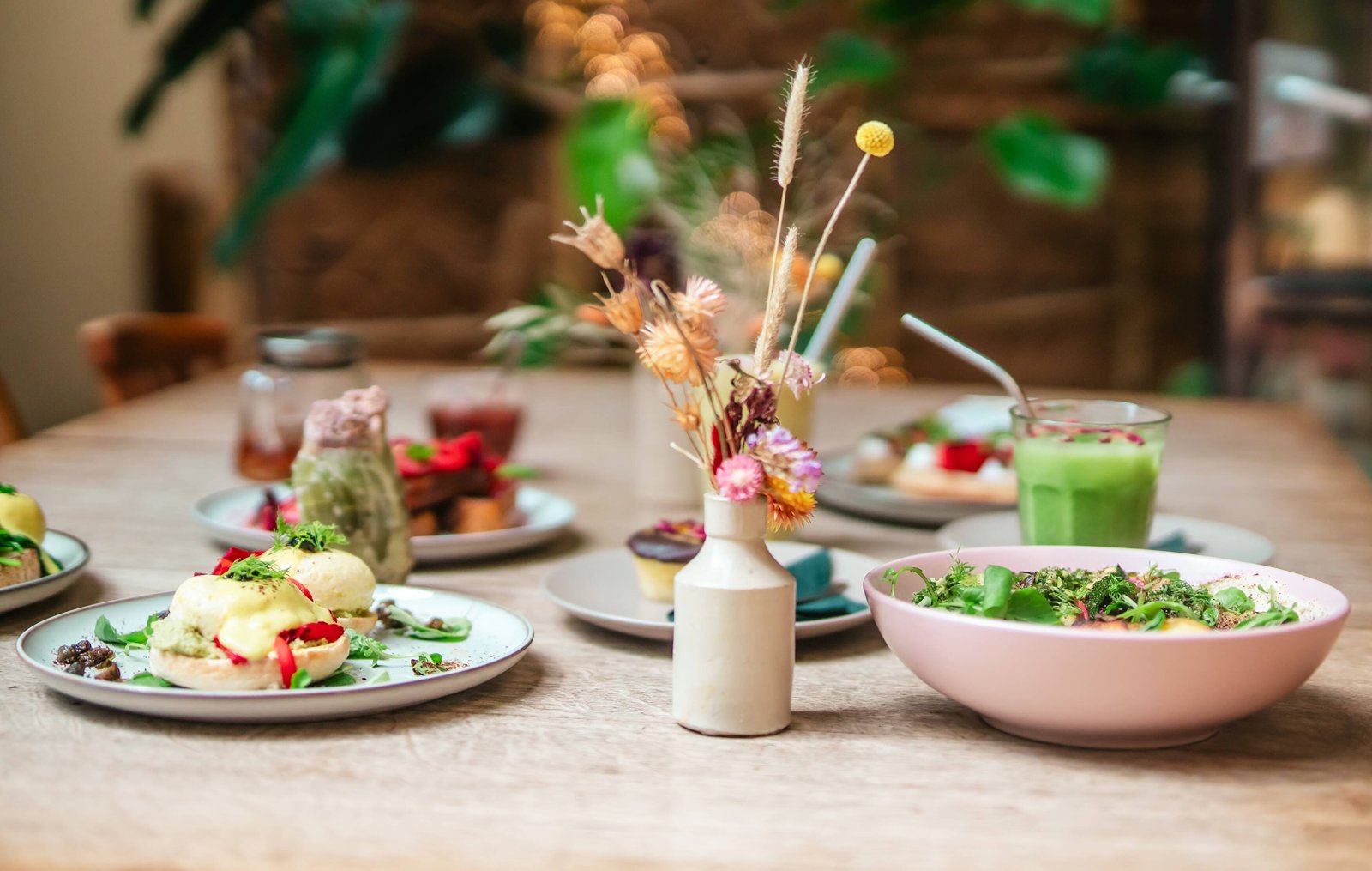 A table of colourful plant-based dishes at Sacred Grounds