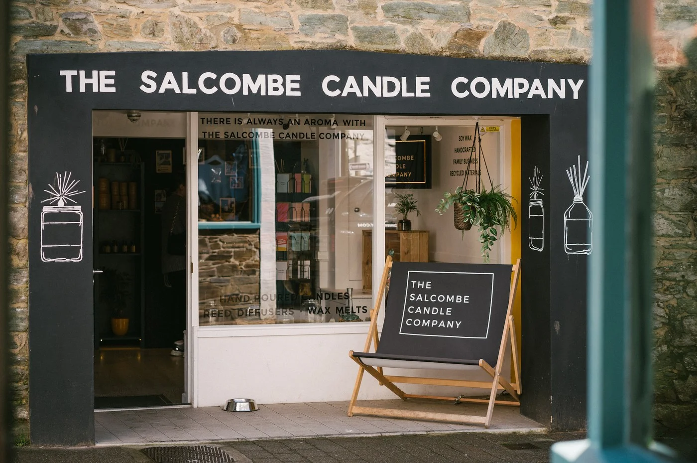 Dark-painted Salcombe Candle Company shopfront on Fore Street