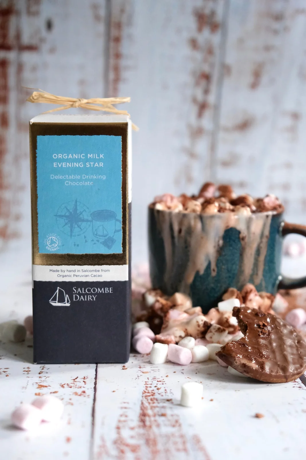 Hot chocolate in glass cups beside a Salcombe Dairy chocolate box