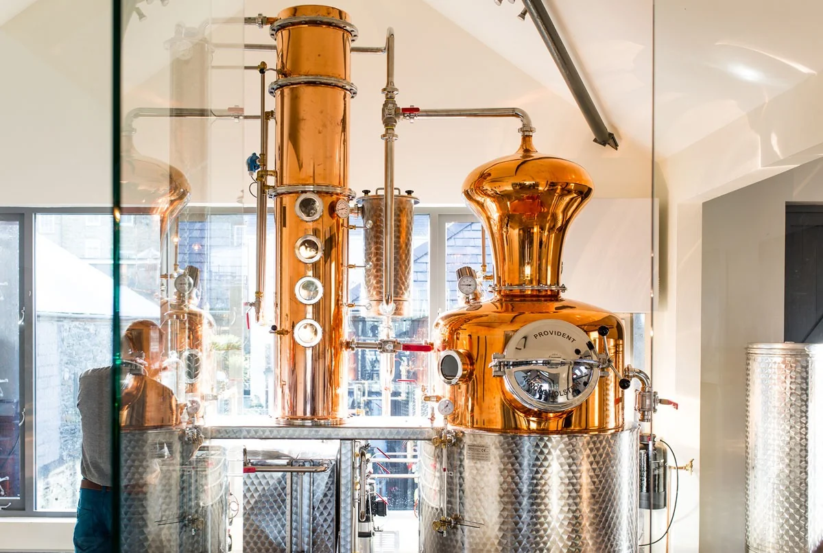 Large polished copper still at Salcombe Distilling Co.