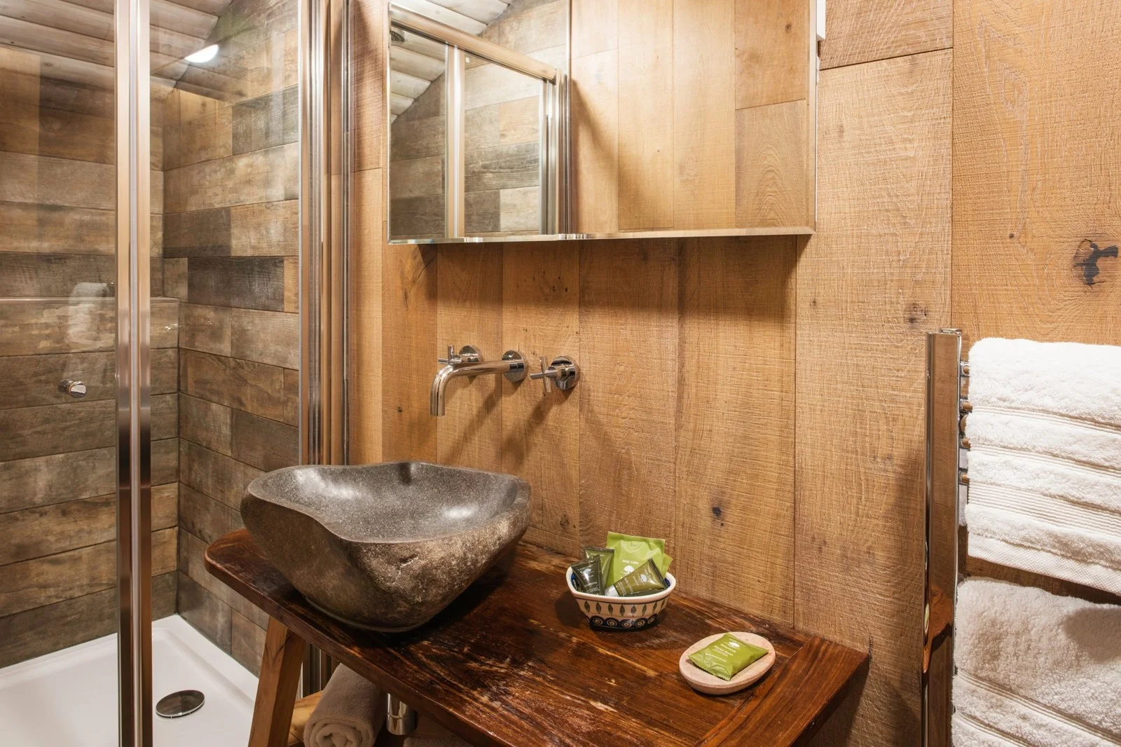 Treehouse shower room with stone basin