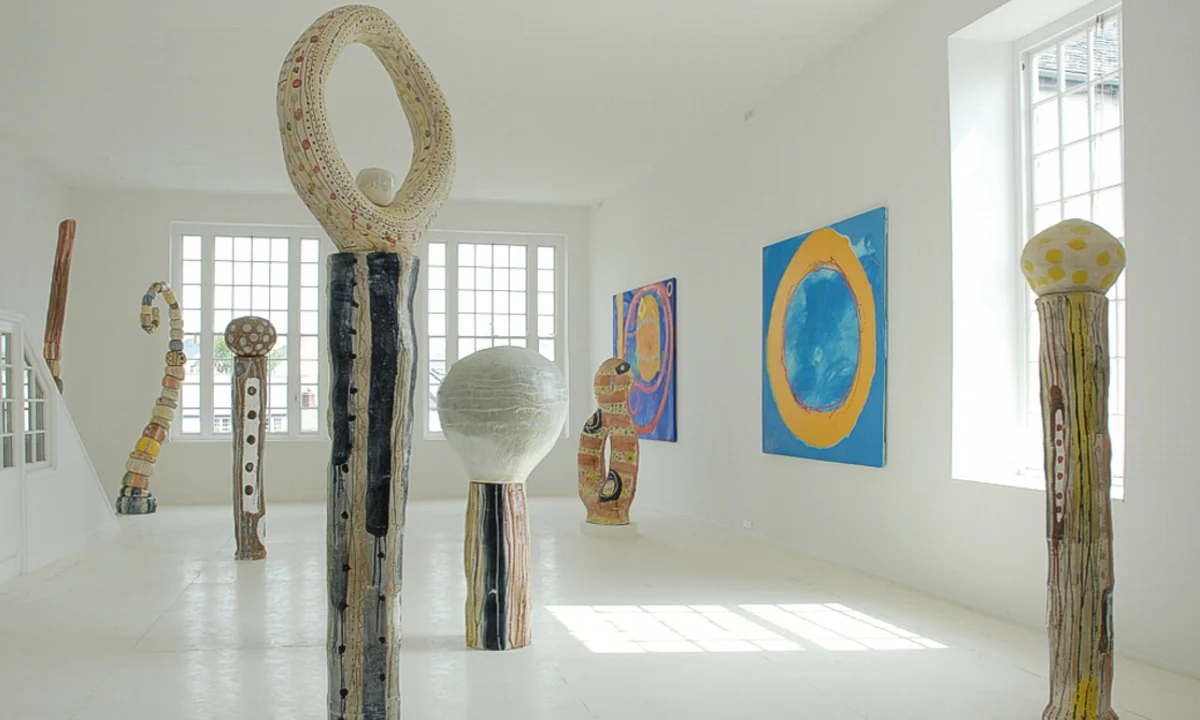 Tall ceramic sculptures and colourful paintings in Sandy Brown’s light-filled gallery