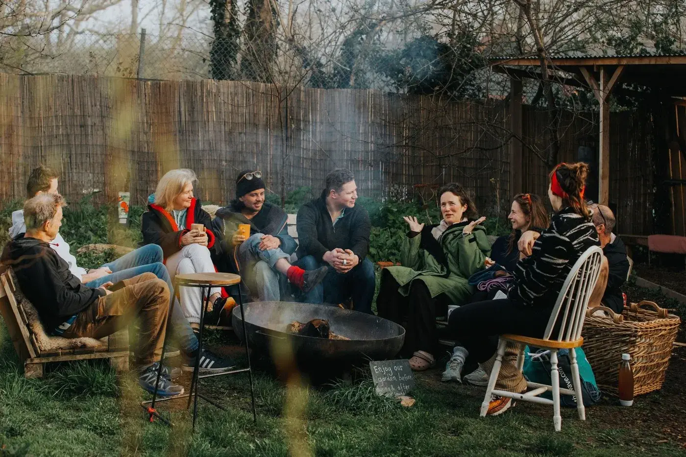 Guests sitting in the outdoor space at the Dartington sauna