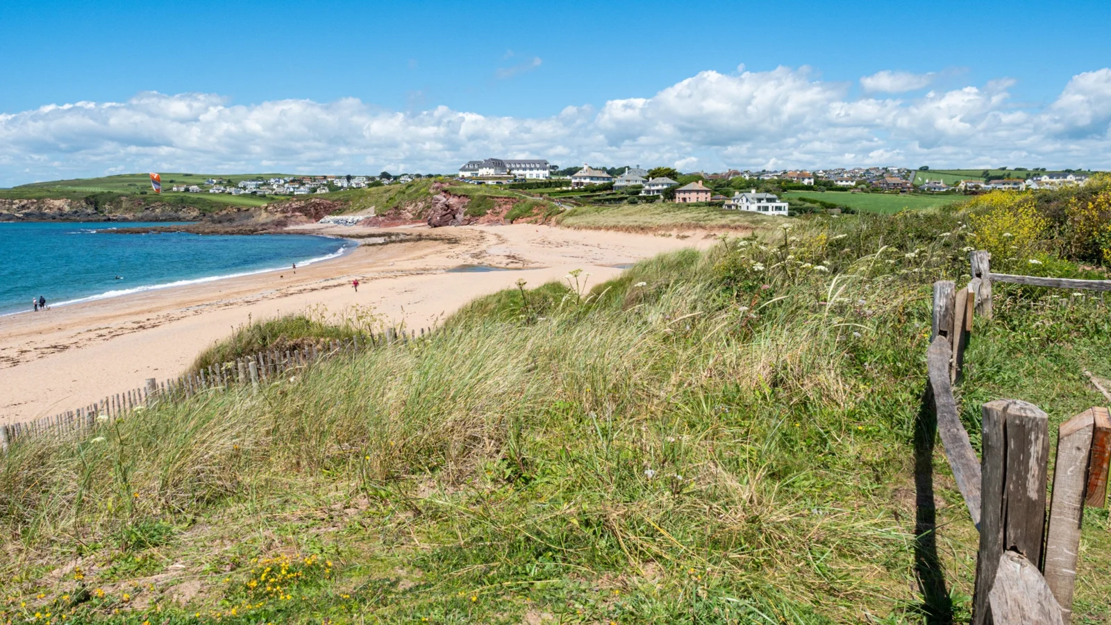 Wide sandy beach at South Milton viewed from the grassy edge