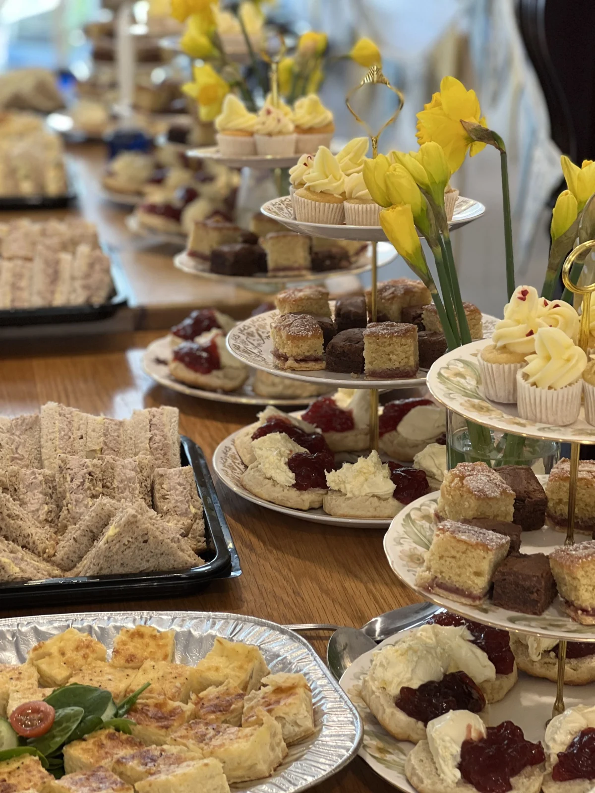 Tiered stands of cakes, scones and sandwiches at Station House