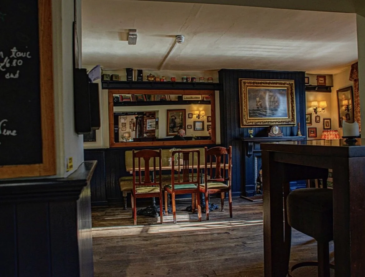 The Steam Packet Inn’s traditional bar with wooden stools